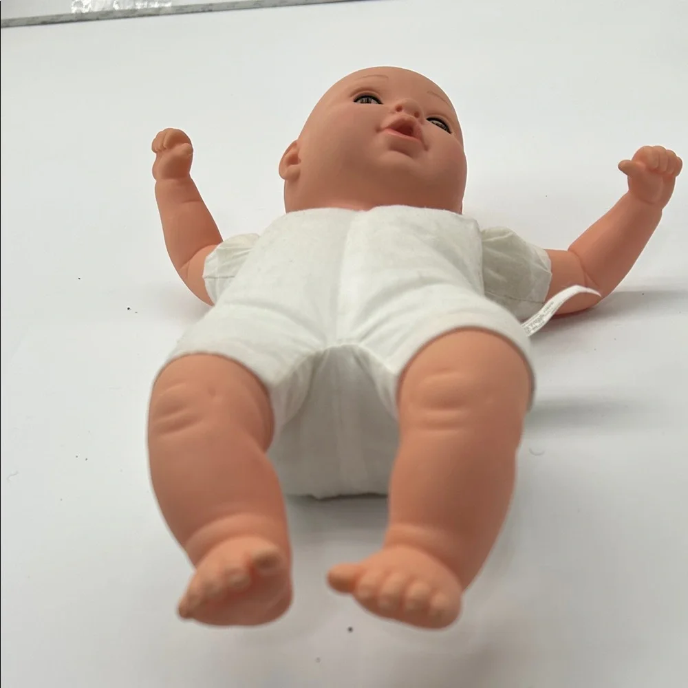 Realistic Baby Doll with White Outfit